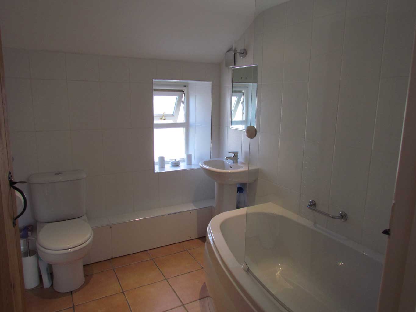 Family bathroom with bath/shower over